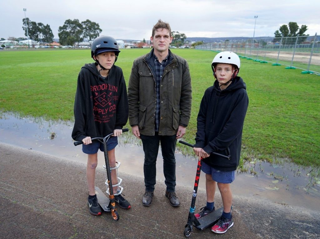 Zach Garnett, 12, and Justin Latham-Ayres, 13, with Tim Clifford MLC.